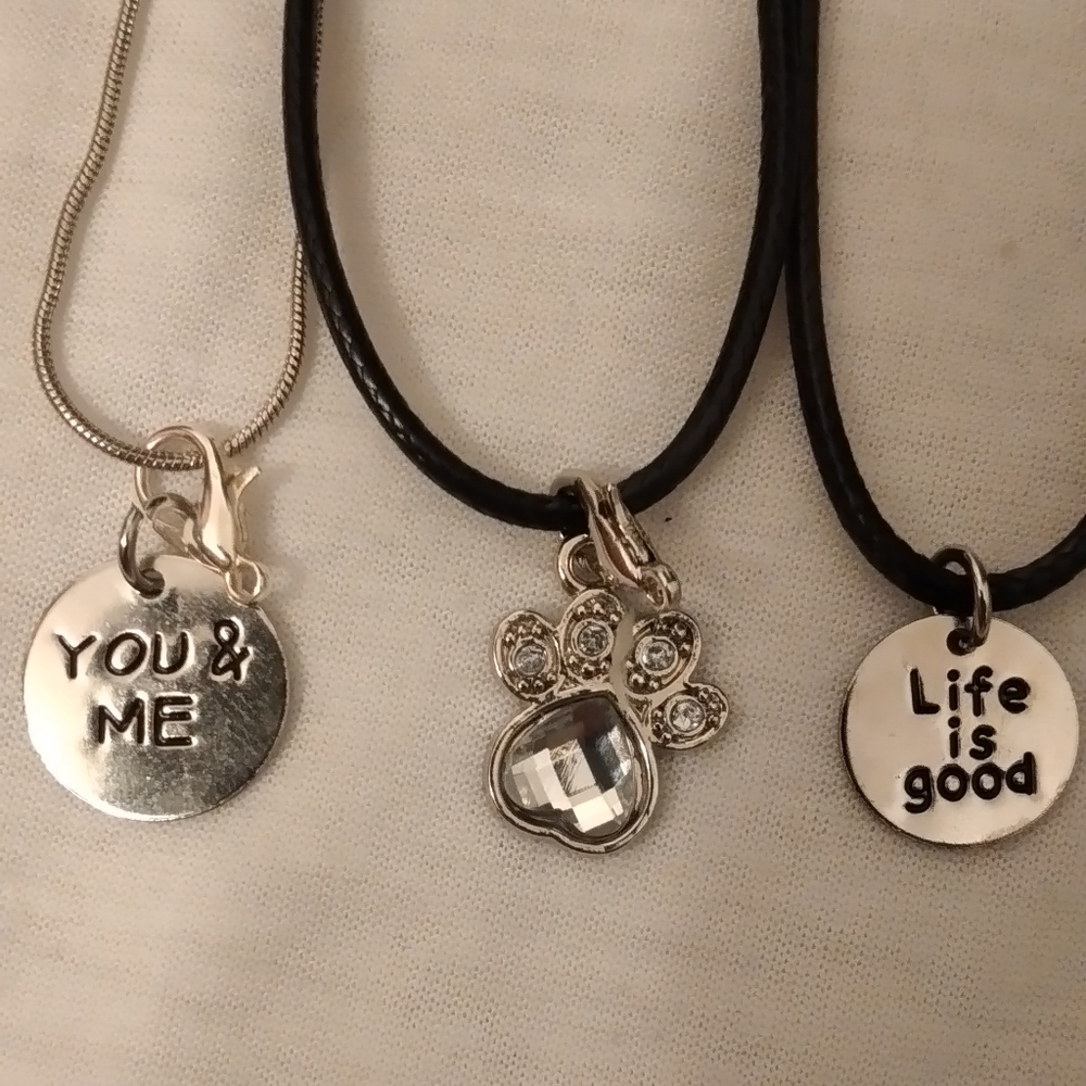 Pretty black necklaces with cute charms. Bangle bracelets. Good gifts.
